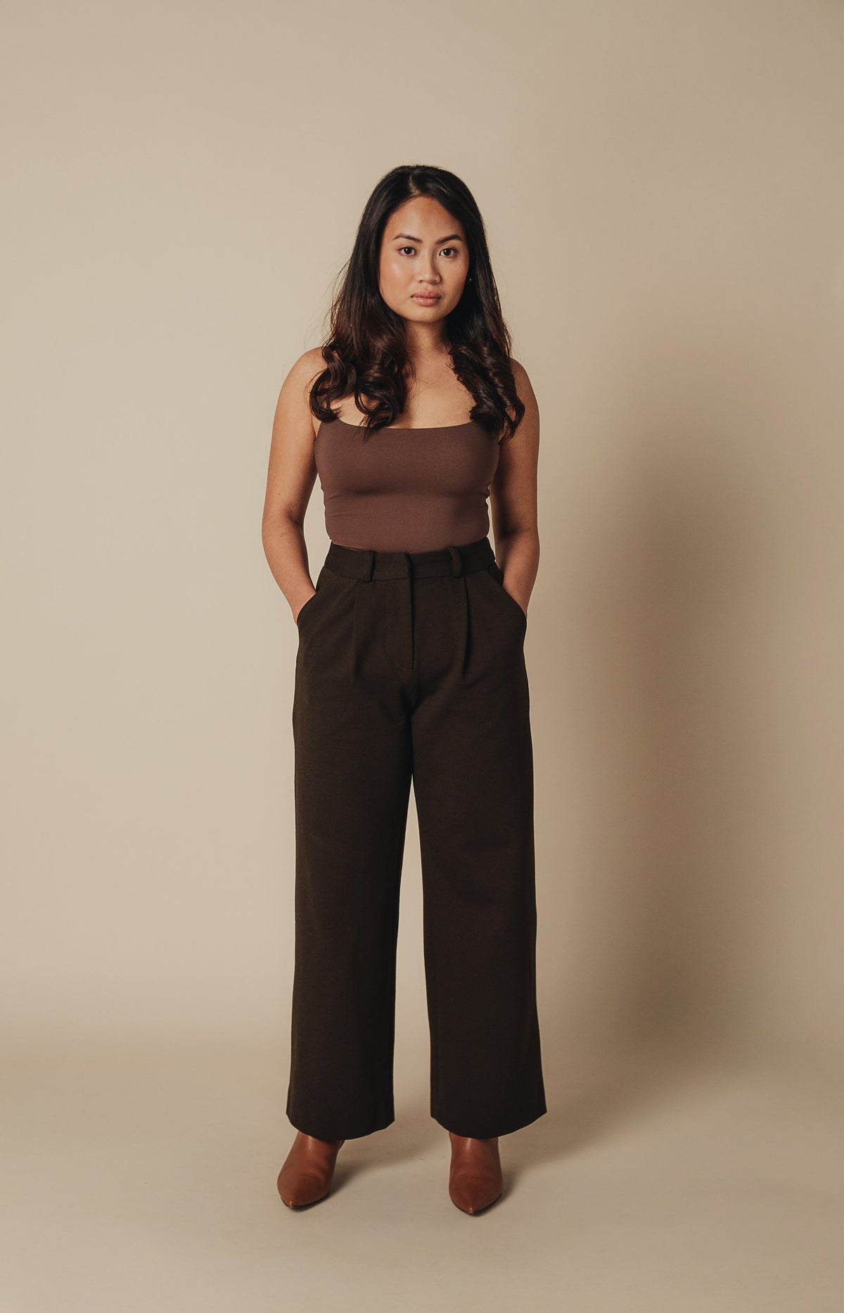 Petite dress pants in Espresso, a deep warm brown, front view in the studio, wide straight leg cut for petite proportions