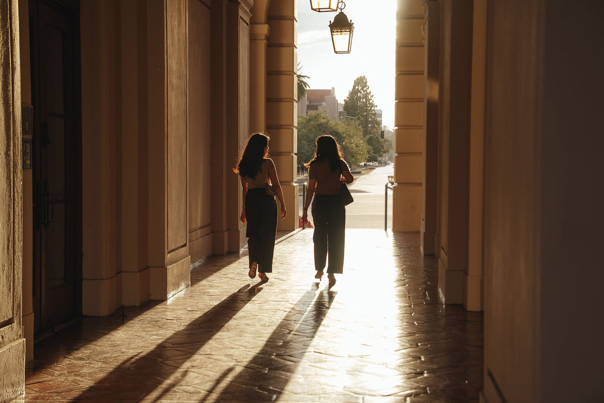 Petite dress pants in Espresso brown and Midnight navy blue, the founders walking through the arcade at Pasadena City Hall