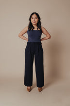 Petite dress pants in Midnight, a deep navy blue, front view in the studio, wide straight leg cut for petite proportions