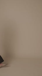 Petite dress pants in Espresso, a deep warm brown, studio turn showing the front, side, back pockets and pleated waistband