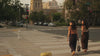 Petite dress pants in Espresso brown and Midnight navy blue, the founders walking to work through city hall at golden hour